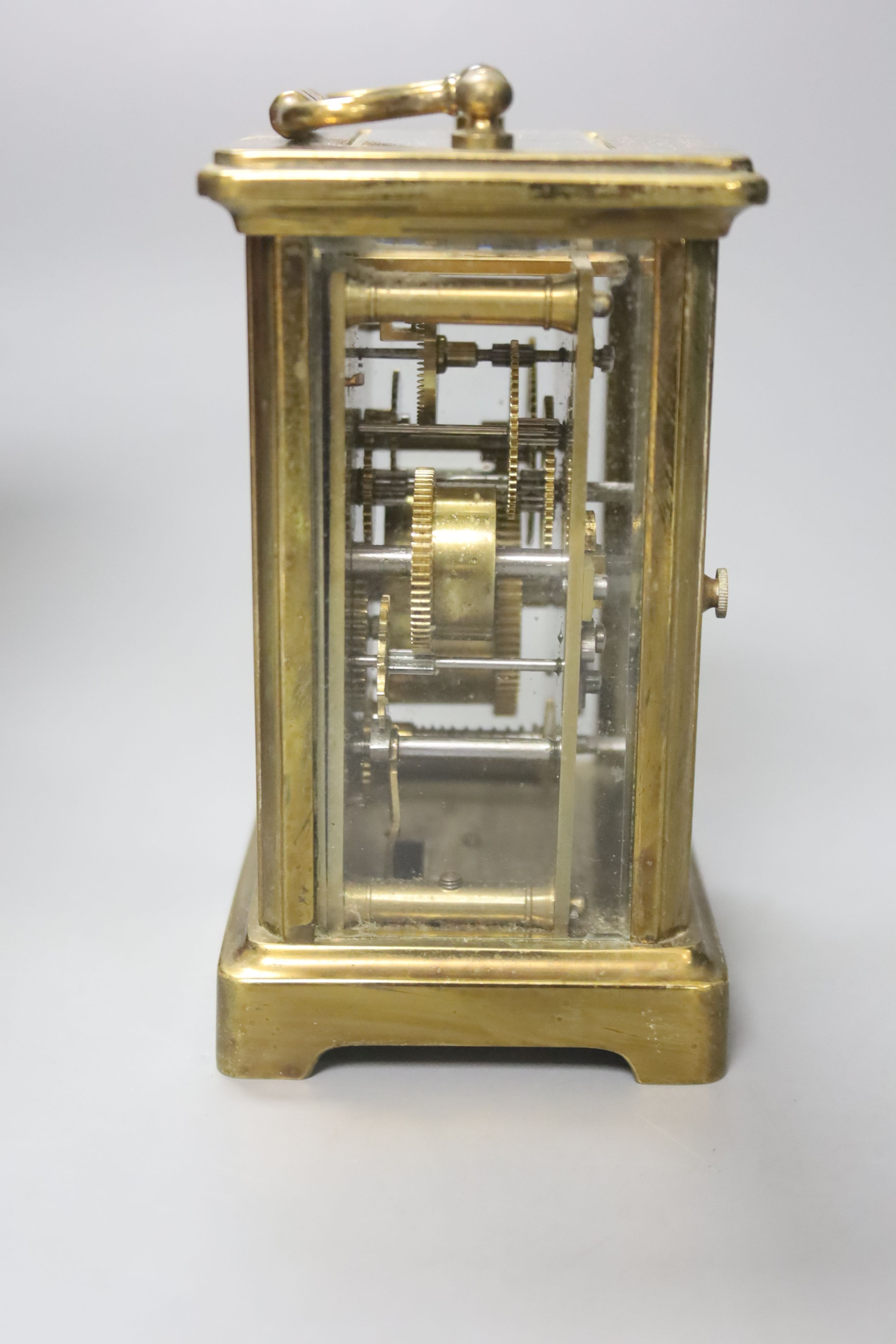 A French brass carriage alarm timepiece in leather case, 11cm high